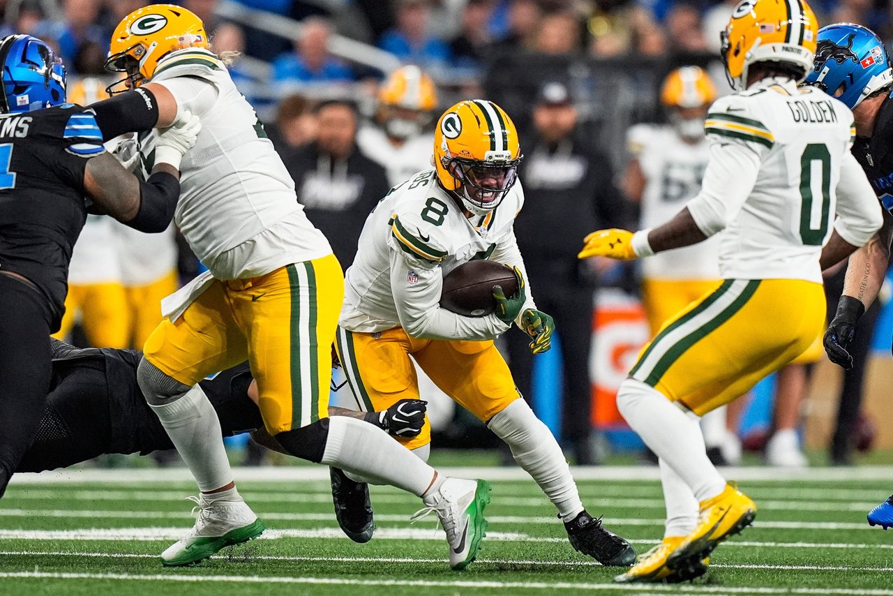 Green Bay Packers running back Josh Jacobs (8) runs against Detroit Lions during the first half at Ford Field in Detroit on