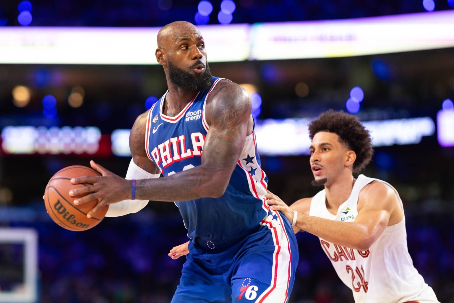 Philadelphia, Pennsylvania, USA; Philadelphia 76ers forward LeBron James (23) controls the ball against Cleveland Cavaliers guard Tyrese Proctor (24) during the second quarter at Xfinity Mobile Arena. Mandatory Credit: Bill Streicher-Imagn Images