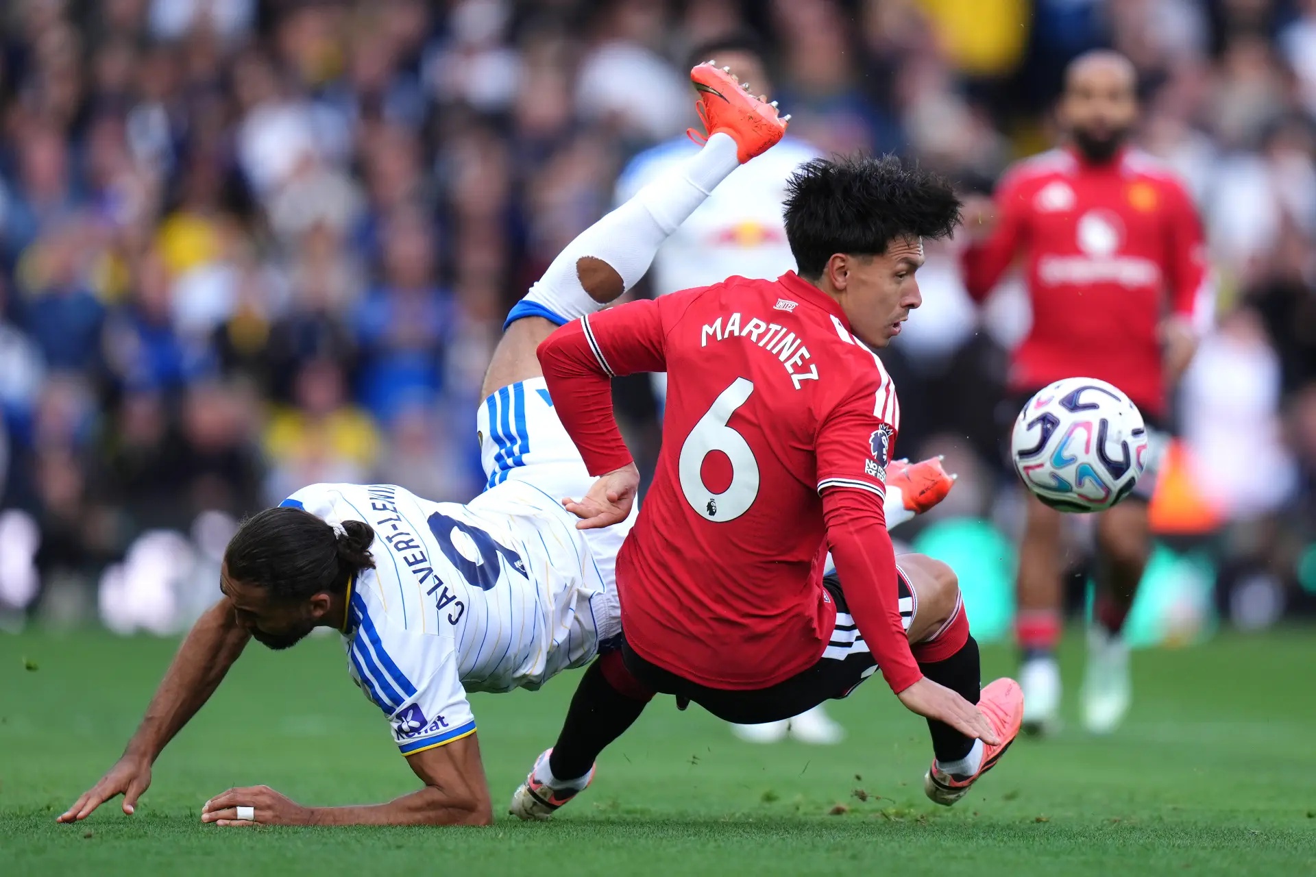 Lisandro Martínez (right) challenging Dominic Calvert-Lewin.