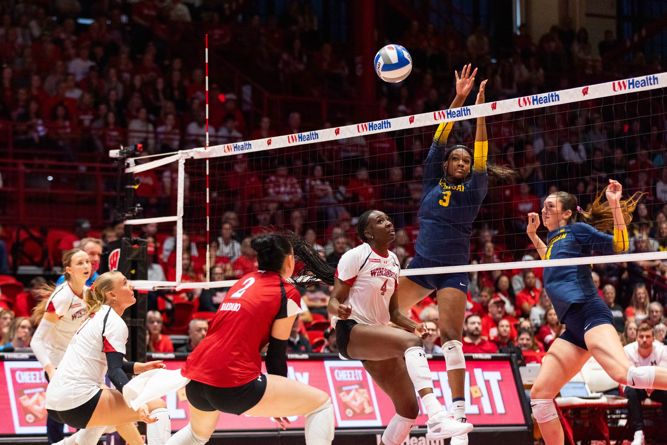 Wisconsin middle blocker Jaela Auguste's attack attempt gets blocked during the Badgers' four-set win over Michigan at the UW Field House in Madison on Oct. 25, 2026.