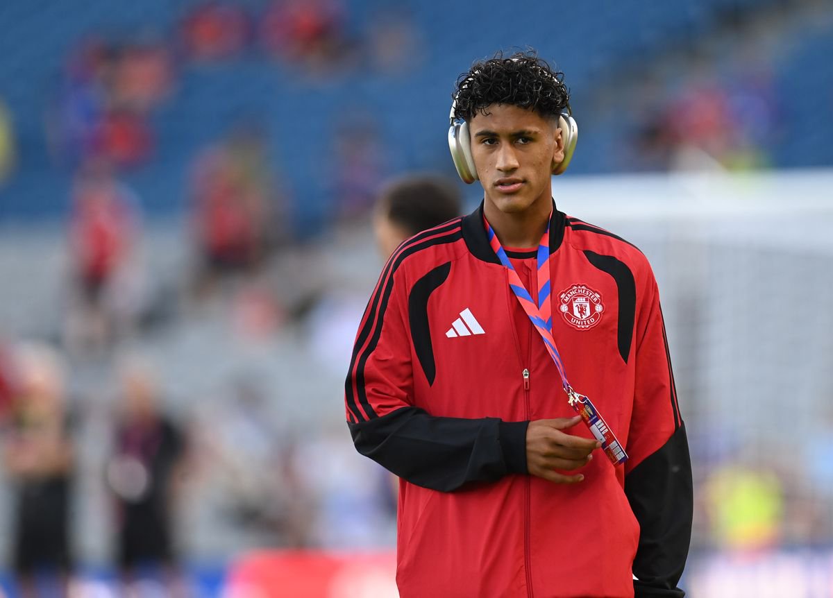 JJ Gabriel looks on wearing headphones