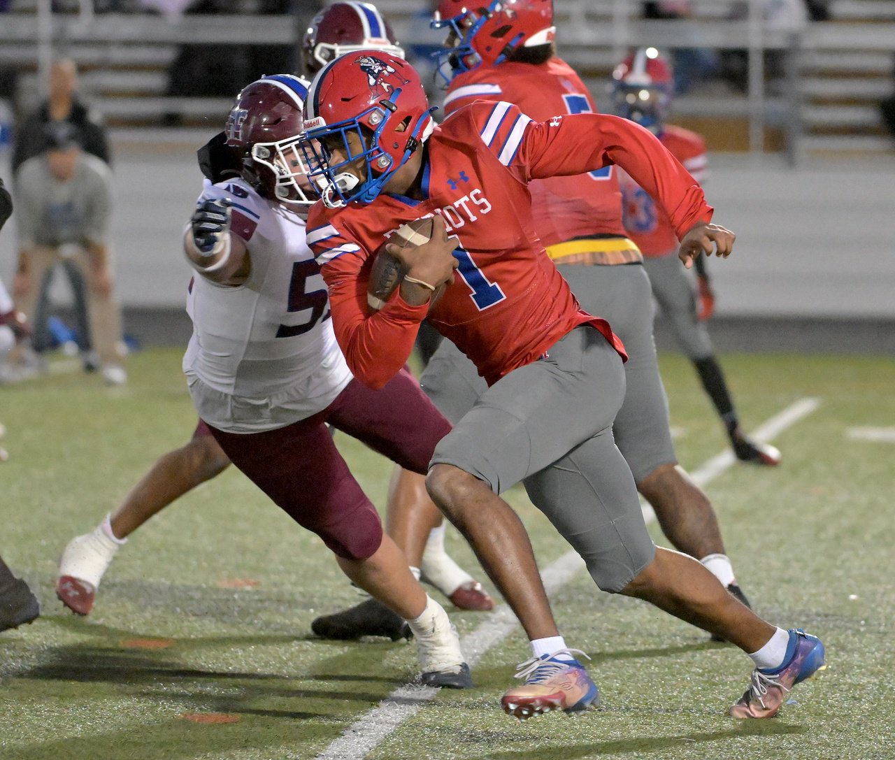 Old Mill Patriots quarterback Braylon Tucker #1 runs in the second quarter.  The Annapolis Panthers host the visiting Old Mill Patriots in a high school football held at Severna Park High School Friday evening. (Paul W. Gillespie/Staff)