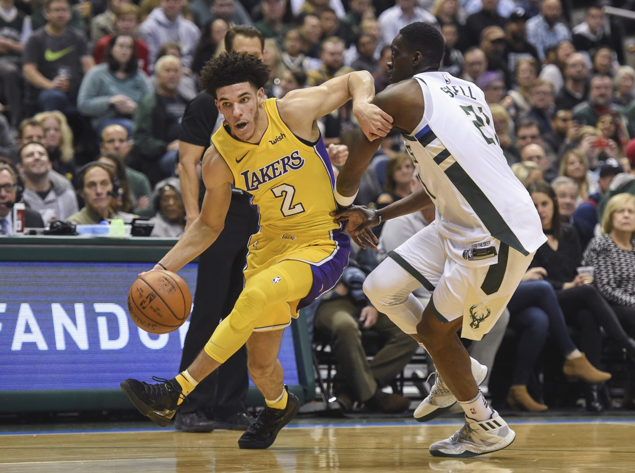 Nov 11, 2017; Milwaukee, WI, USA; Los Angeles Lakers guard Lonzo Ball (2) drives for the basket against Milwaukee Bucks guard Tony Snell (21) in the first quarter at BMO Harris Bradley Center. Mandatory Credit: Benny Sieu-USA TODAY Sports