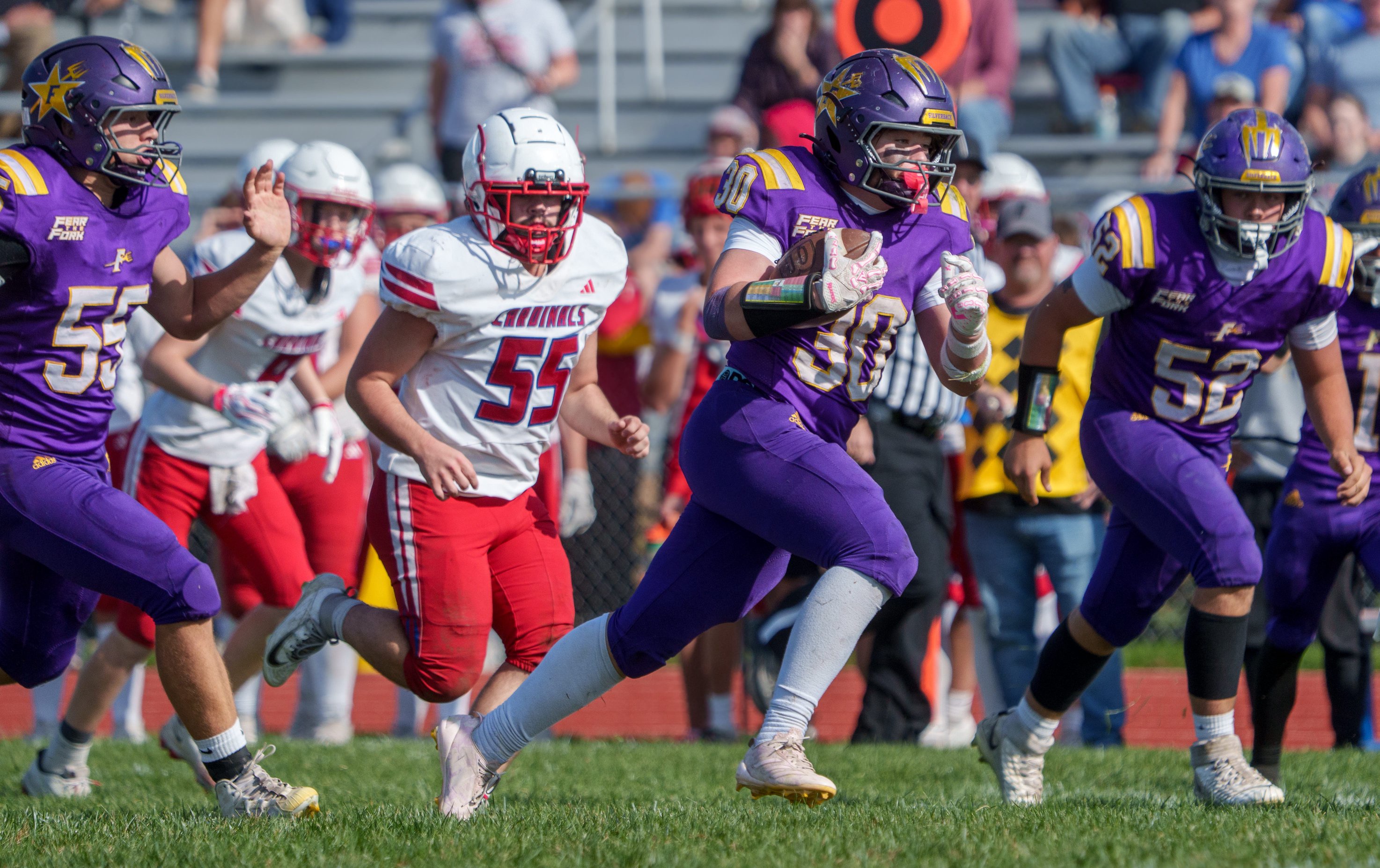 Farmington running back Braydn Brewer finds room to run against Pleasant Plains in the first half of the opening round of the Class 2A high school football playoffs Saturday, Oct. 24, 2026 in Farmington. The Farmers defeated the Cardinals 22-16.