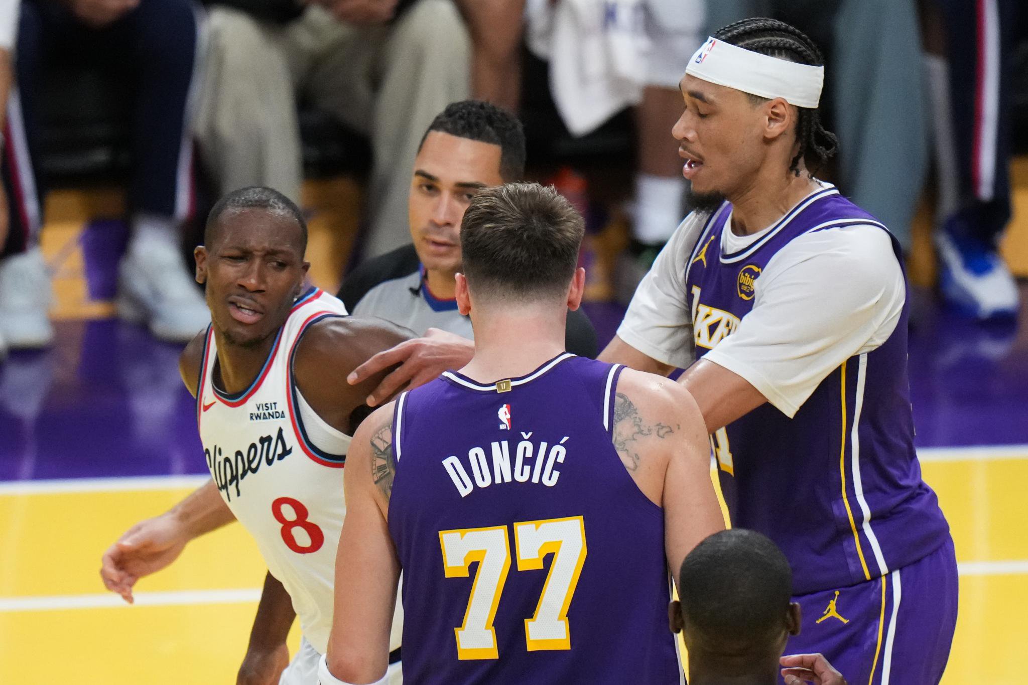 Los Angeles Lakers center Jaxson Hayes pushing Los Angeles Clippers guard Kris Dunn.