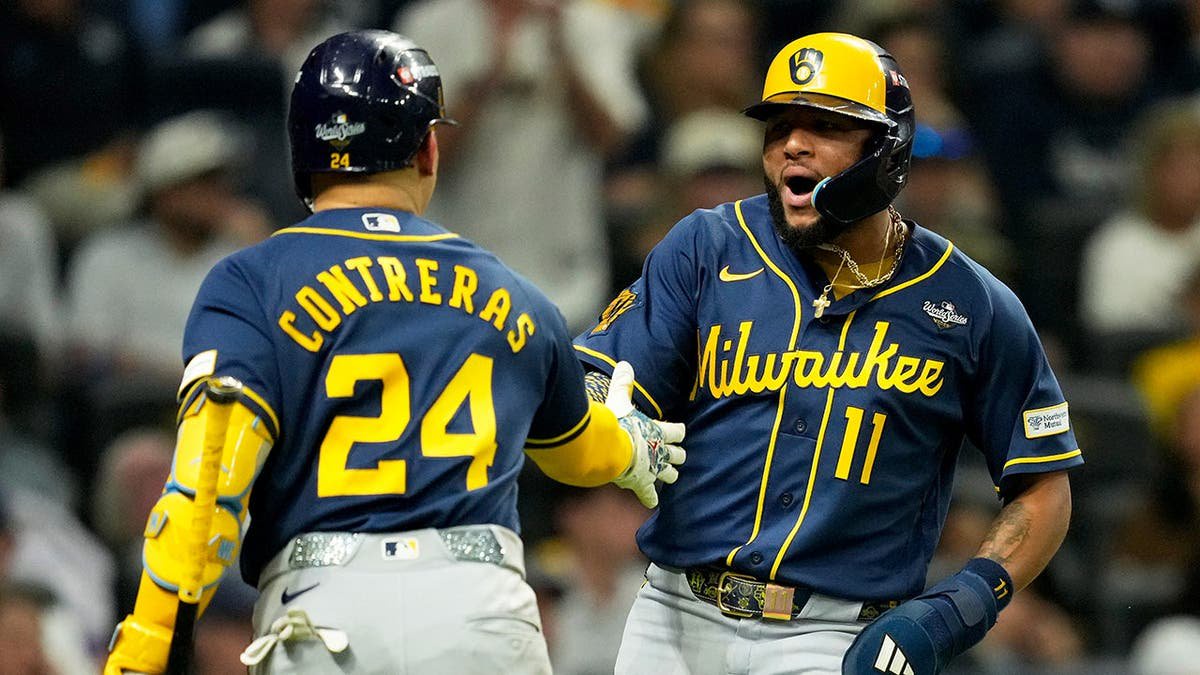 Jackson Chourio celebrates after scoring during the third inning of the World Series.