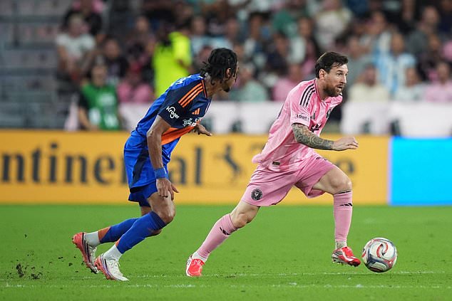 Inter Miami forward Lionel Messi, right, is pursued by FC Cincinnati forward Kenji Mboma Dem during the first half of an MLS soccer match, Wednesday, Oct. 28, 2026, in Miami. (AP Photo/Rebecca Blackwell)