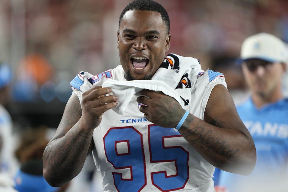 Jordan Elliott of the Tennessee Titans looks from the sidelines against the San Francisco 49ers at Levi's Stadium on August 13, 2026. He has been released from the team after pulling a gun at the team facility. 