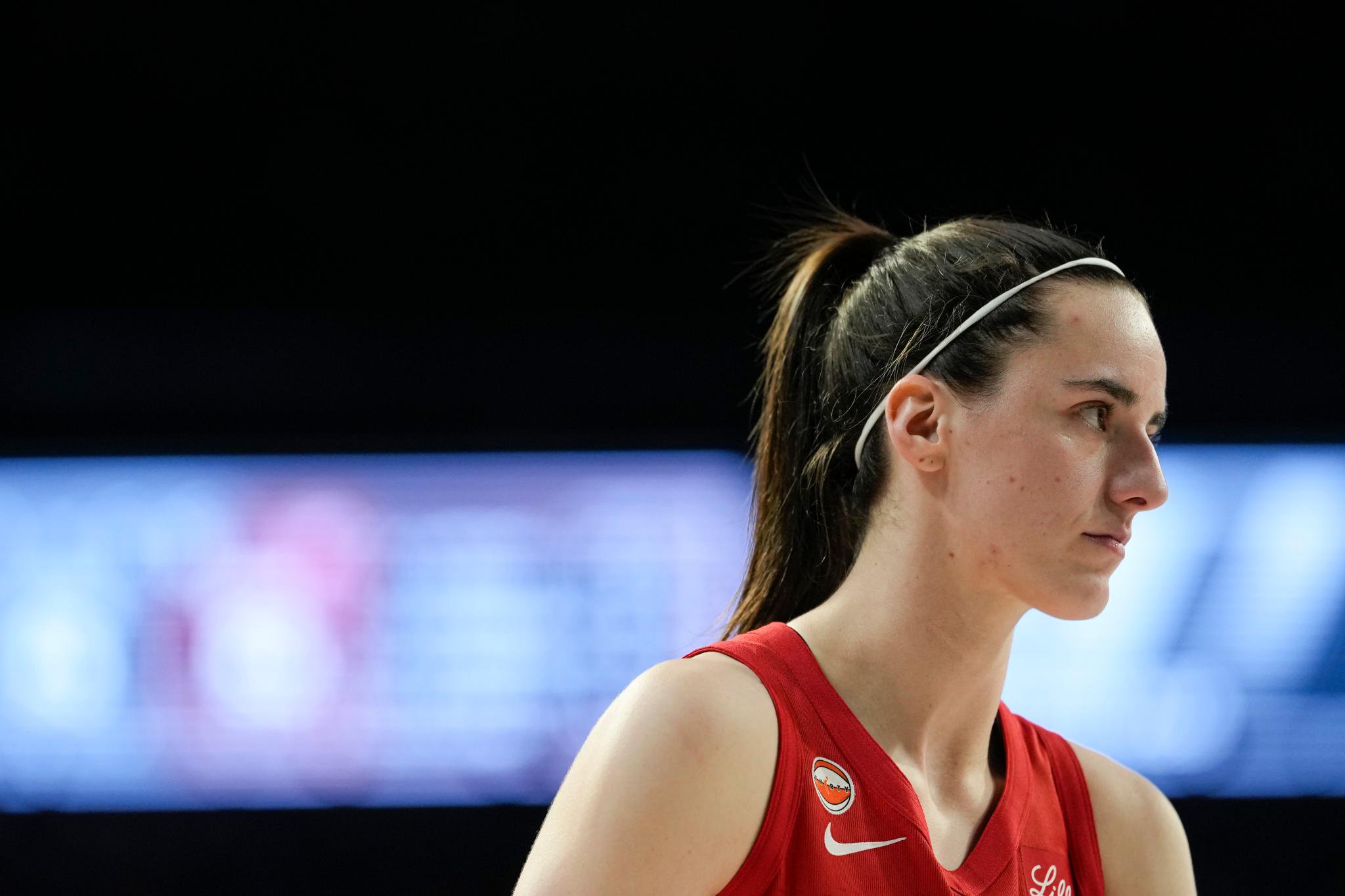 Indiana Fever guard Caitlin Clark looks outward during a game against the Las Vegas Aces.