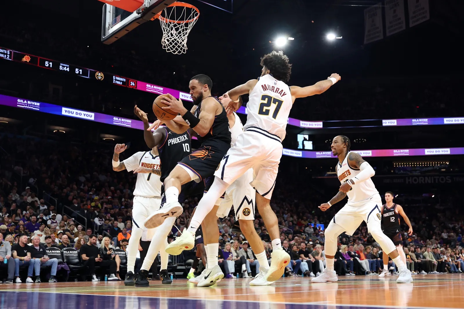 Phoenix Suns star Dillon Brooks drives against the Denver Nuggets