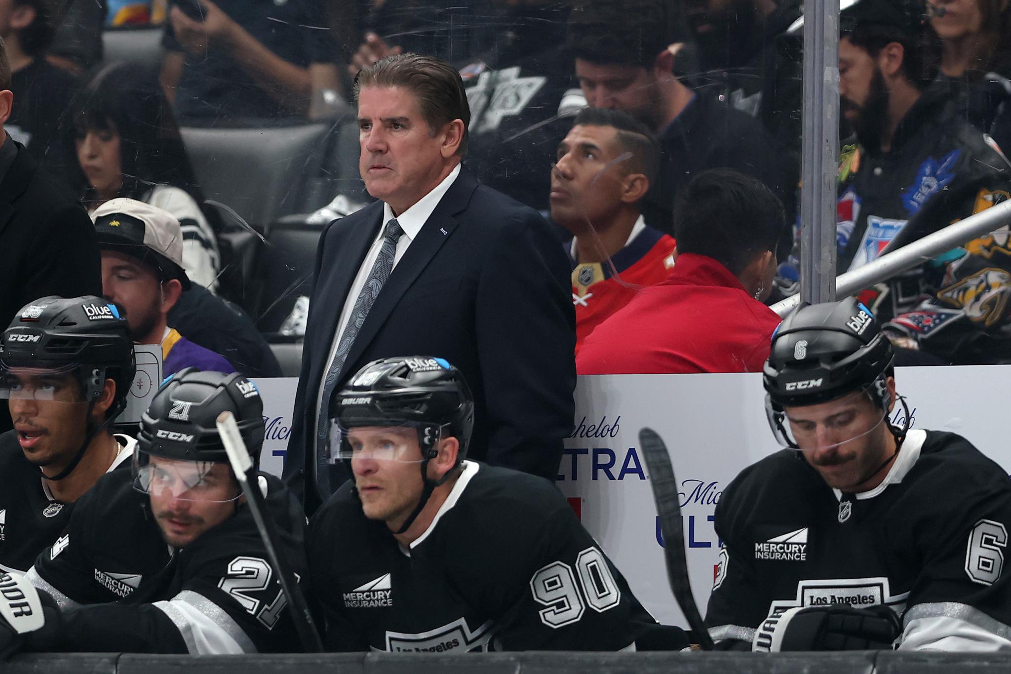 Head coach Peter Laviolette of the Los Angeles Kings looks on from the bench during a game against the Florida Panthers.