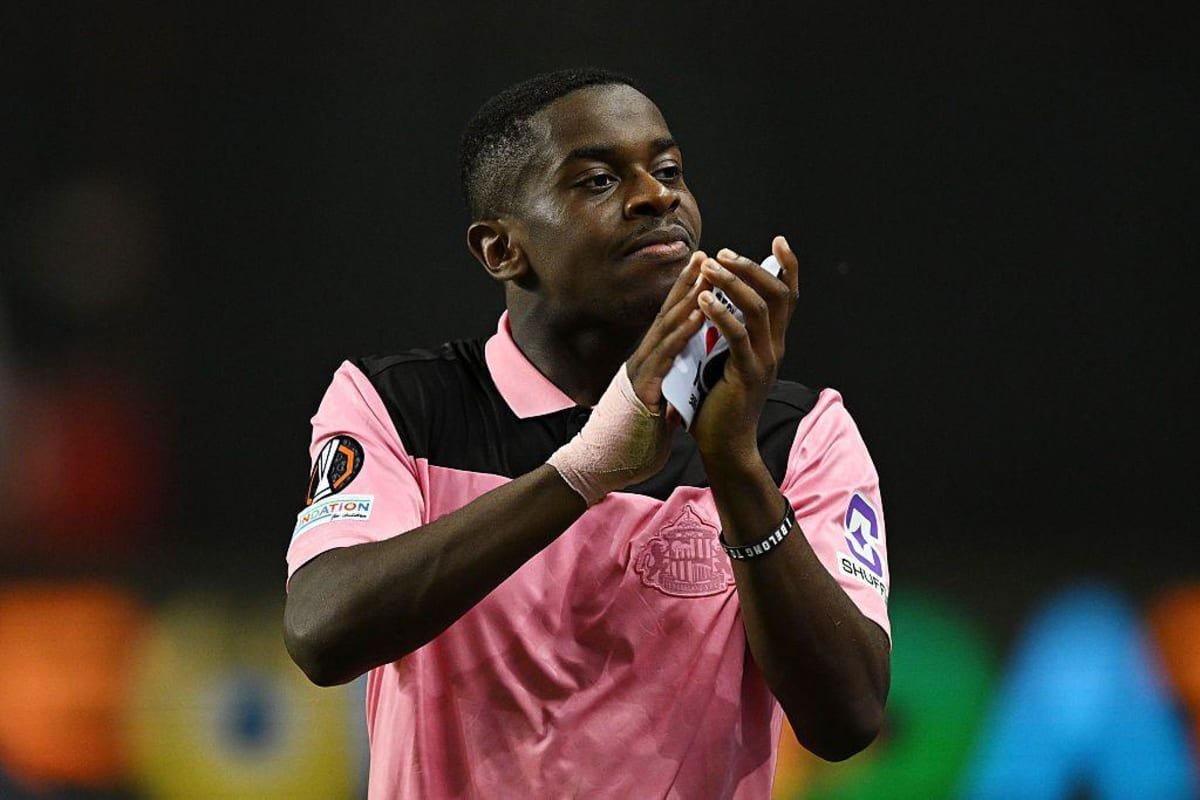 Noah Sadiki of Sunderland applauds the fans