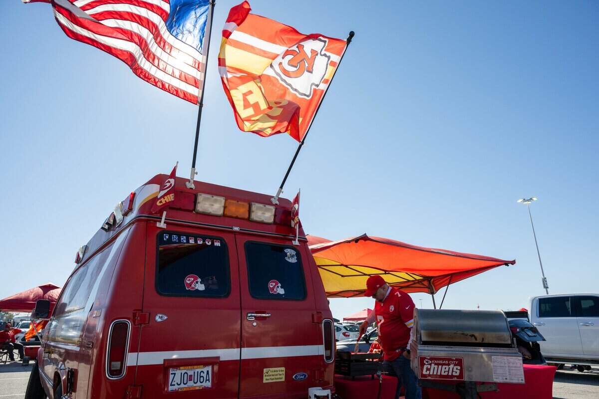A fan grills meat in the parking lot outside the stadium prior to the Chiefs game vs. the Los Angeles Chargers, on Sunday, October 18, 2026, at Arrowhead Stadium.