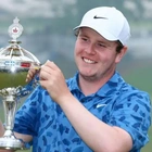 MacIntyre wins first PGA Tour title with dad on bag