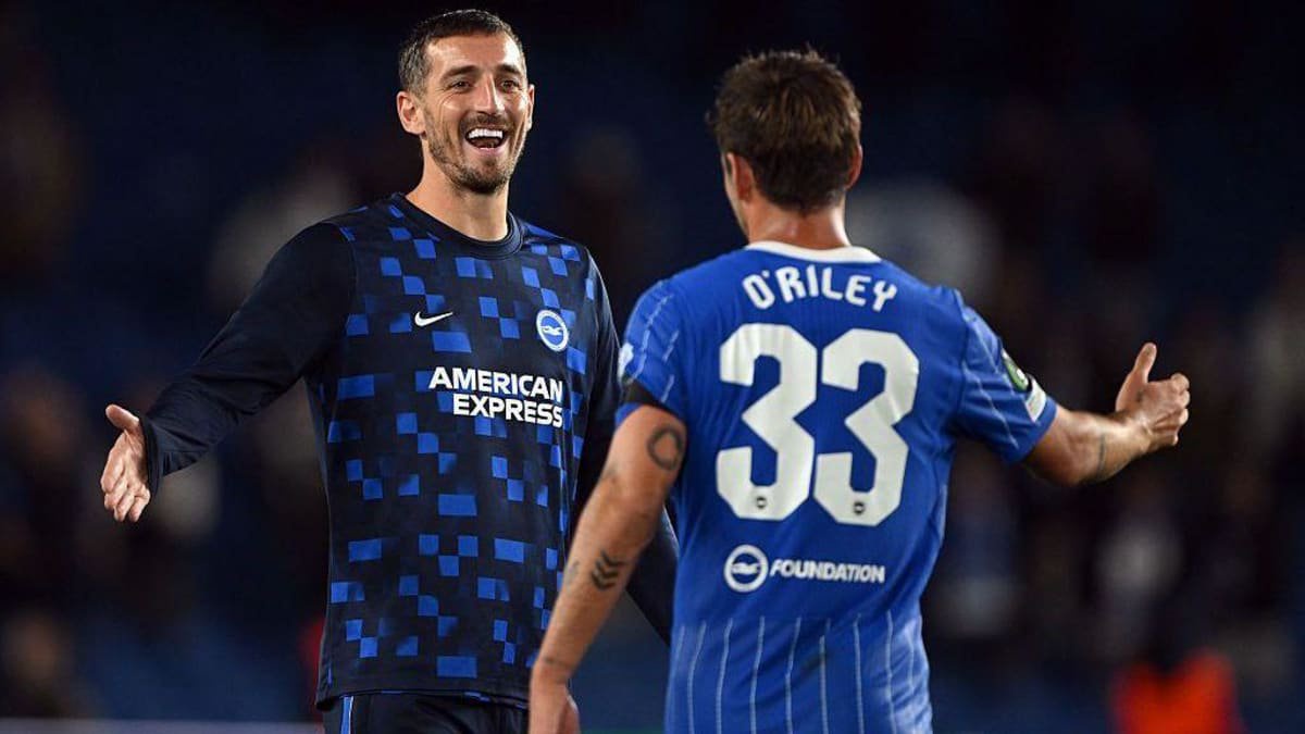 Lewis Dunk and Matt O'Riley embrace