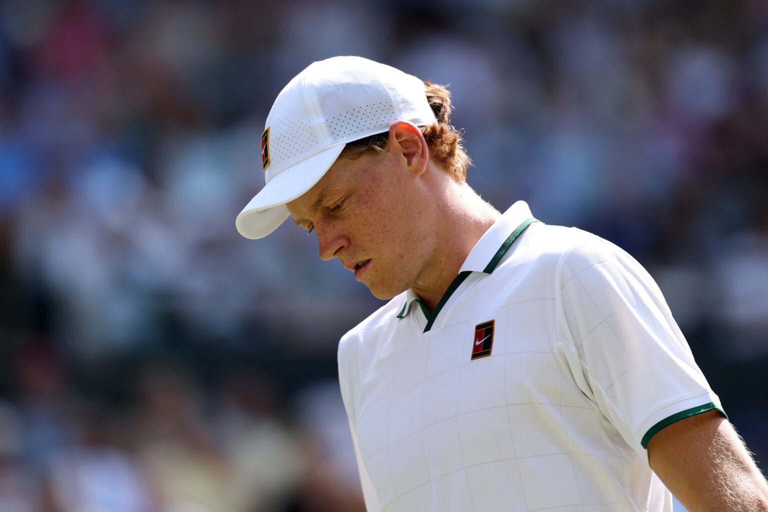 Jannik Sinner looks down at Wimbledon.
