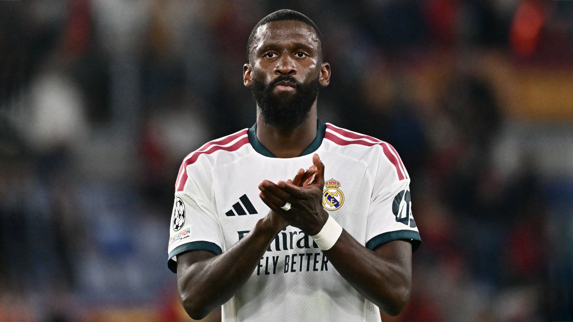 Real Madrid defender Antonio Rudiger applauding.