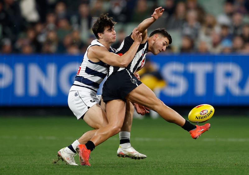 Oisin Mullin of the Geelong tackles Nick Daicos of Collingwood in an Aussie Rules game last July. Photograph: Michael Willson/Getty