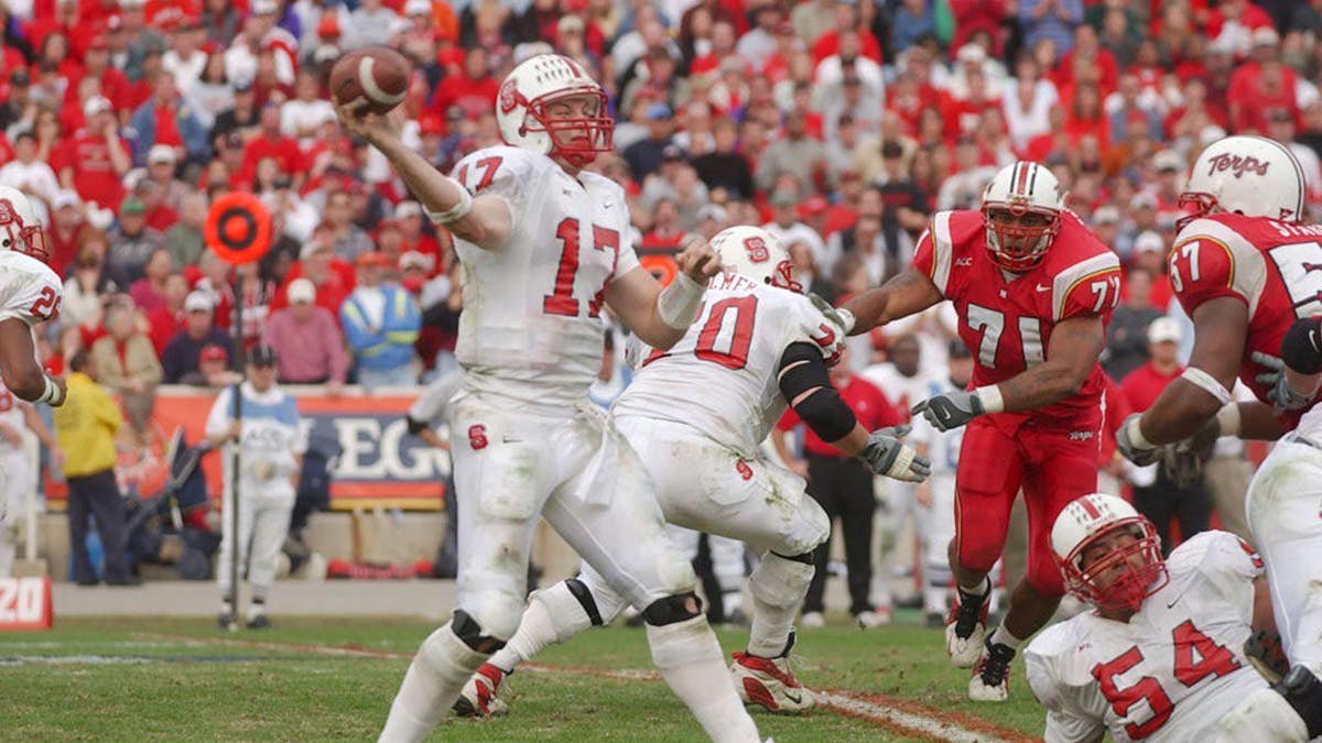 Phillip Rivers throws a pass during a college football game.