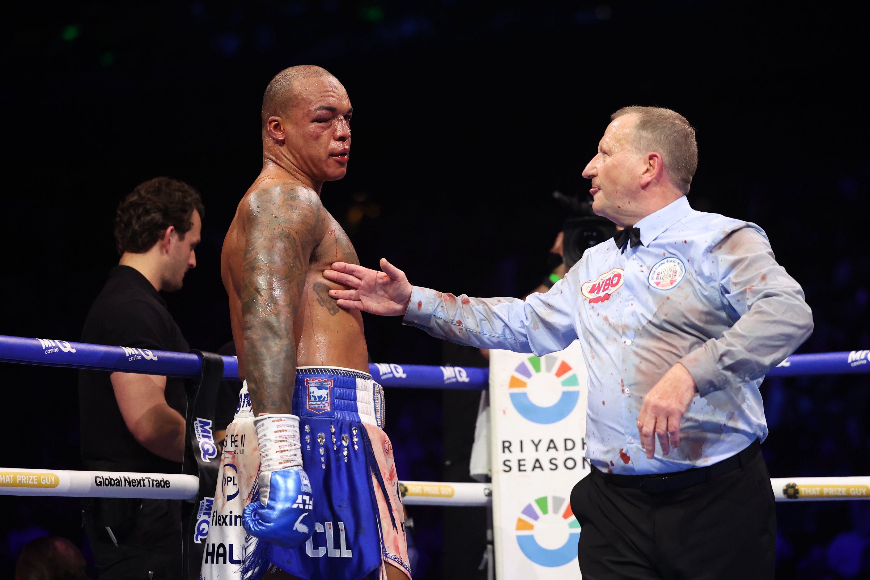 A ringside doctor (left) an referee Howard Foster checked on Wardley before rounds nine and 10