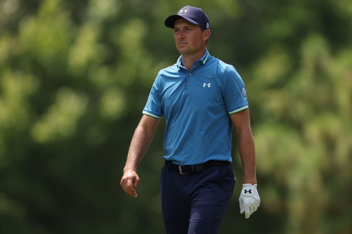 Jordan Spieth looks on