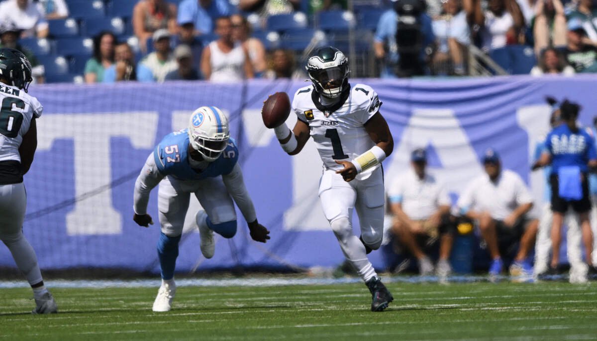 Jalen Hurts, shown here scrambling in a game earlier this season, will miss Sunday’s game for Philadelphia.