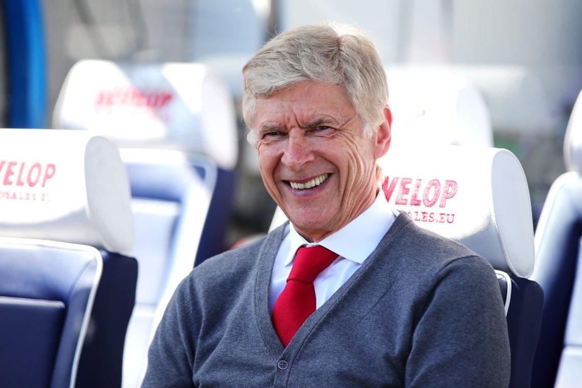 Arsene Wenger smiles during an Arsenal match
