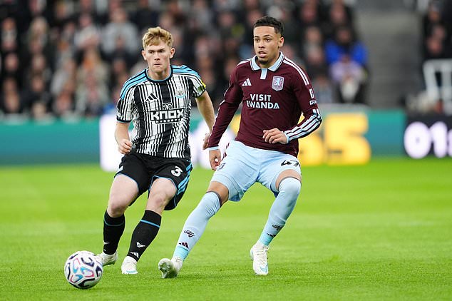 Aston Villa´s Alysson (right) tussles with Lewis Hall of Newcastle (Owen Humphreys/PA)
