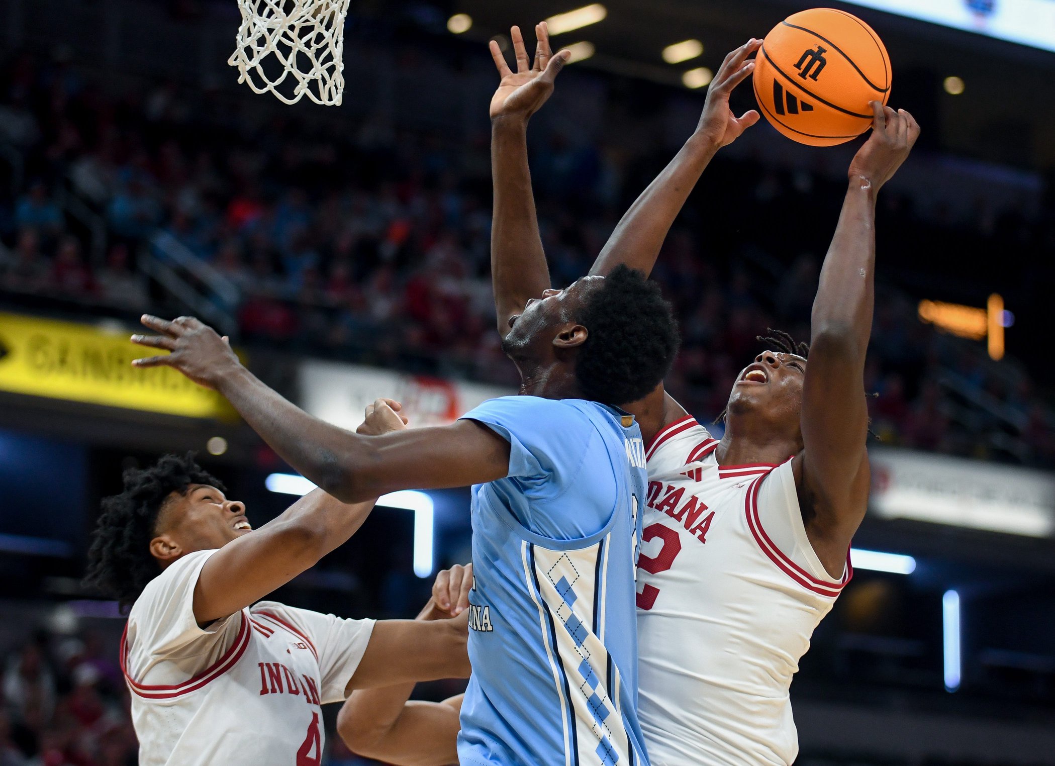 Oct 18, 2026; Indianapolis, IN, USA; Indiana Hoosiers forward Aiden Sherrell (22) rebounds the ball against North Carolina Tar Heels center Sayon Keita (21) during the first half at Gainbridge Fieldhouse. Mandatory Credit: Robert Goddin-Imagn Images