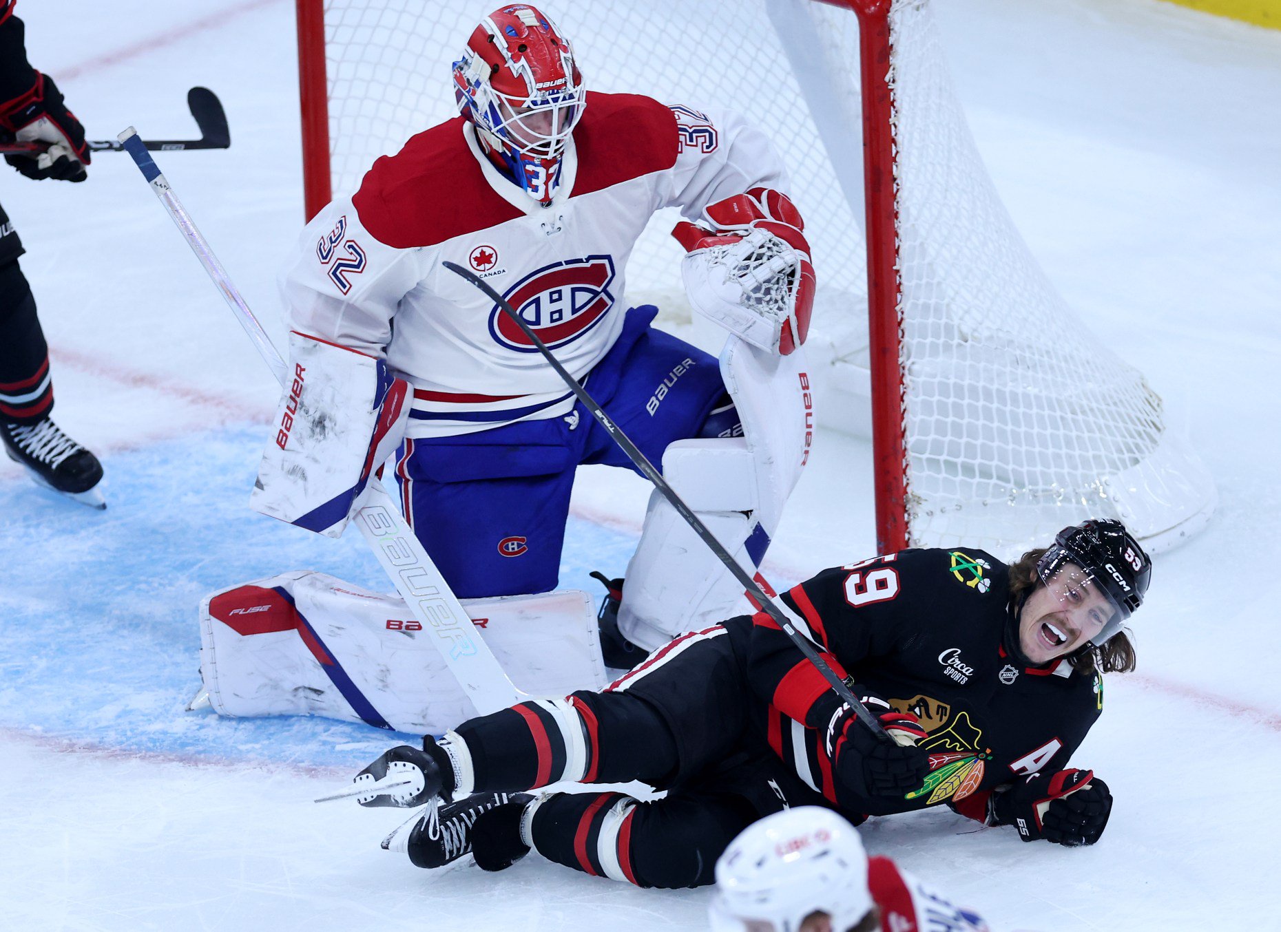 Chicago Blackhawks left wing Tyler Bertuzzi (59) falls to the ice in front of Montréal Canadiens goaltender Jacob Fowler (32) in the second period of a game at the United Center in Chicago on Oct. 23, 2026. (Chris Sweda/Chicago Tribune)