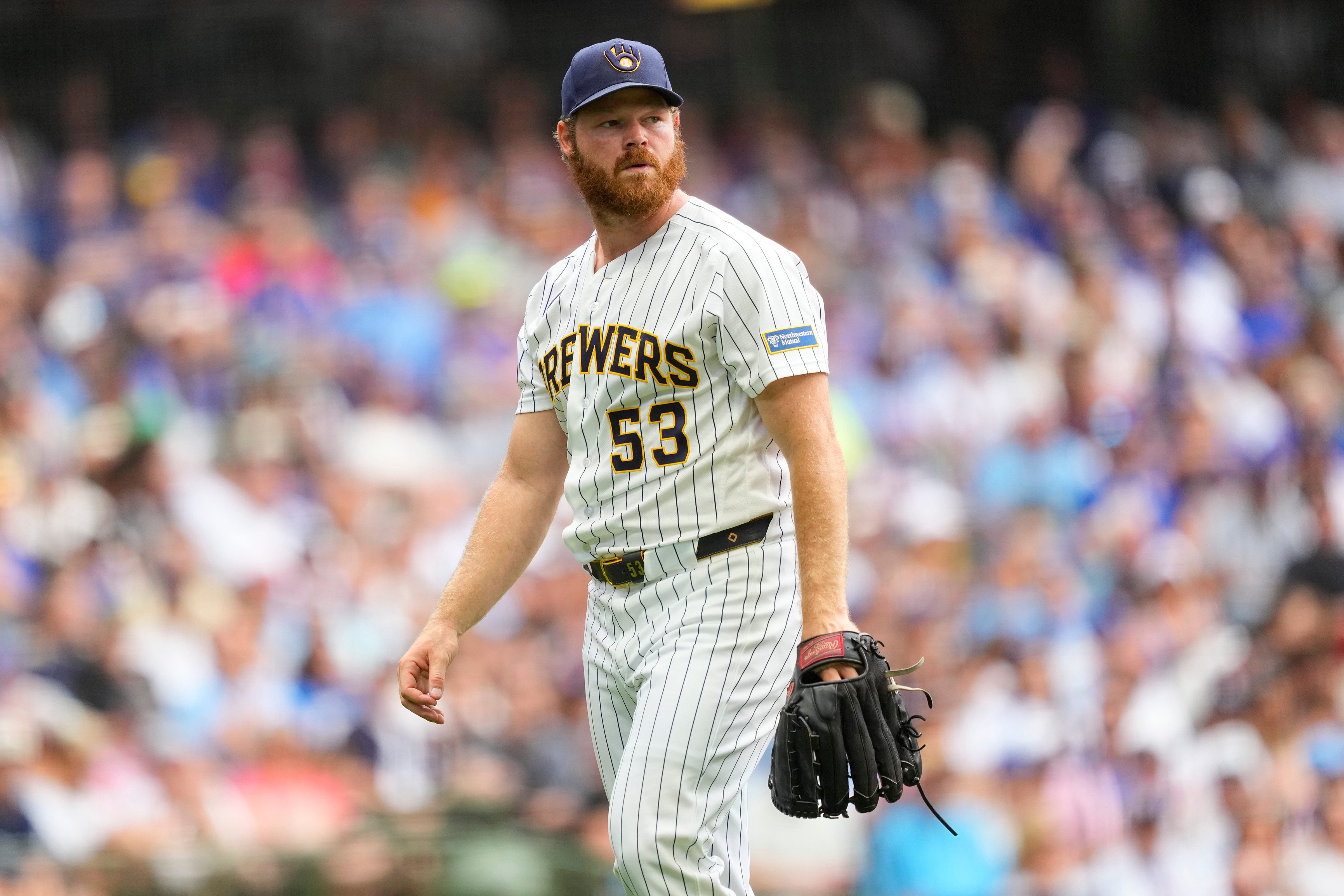 Brewers pitcher Brandon Woodruff walks to the dugout after being removed from the game during the sixth inning against the Cubs at American Family Field in Milwaukee on June 28, 2026.