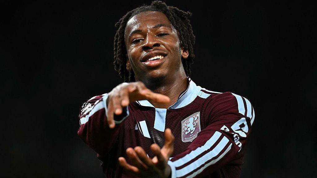 Johan Manzambi gestures with his hands in celebration