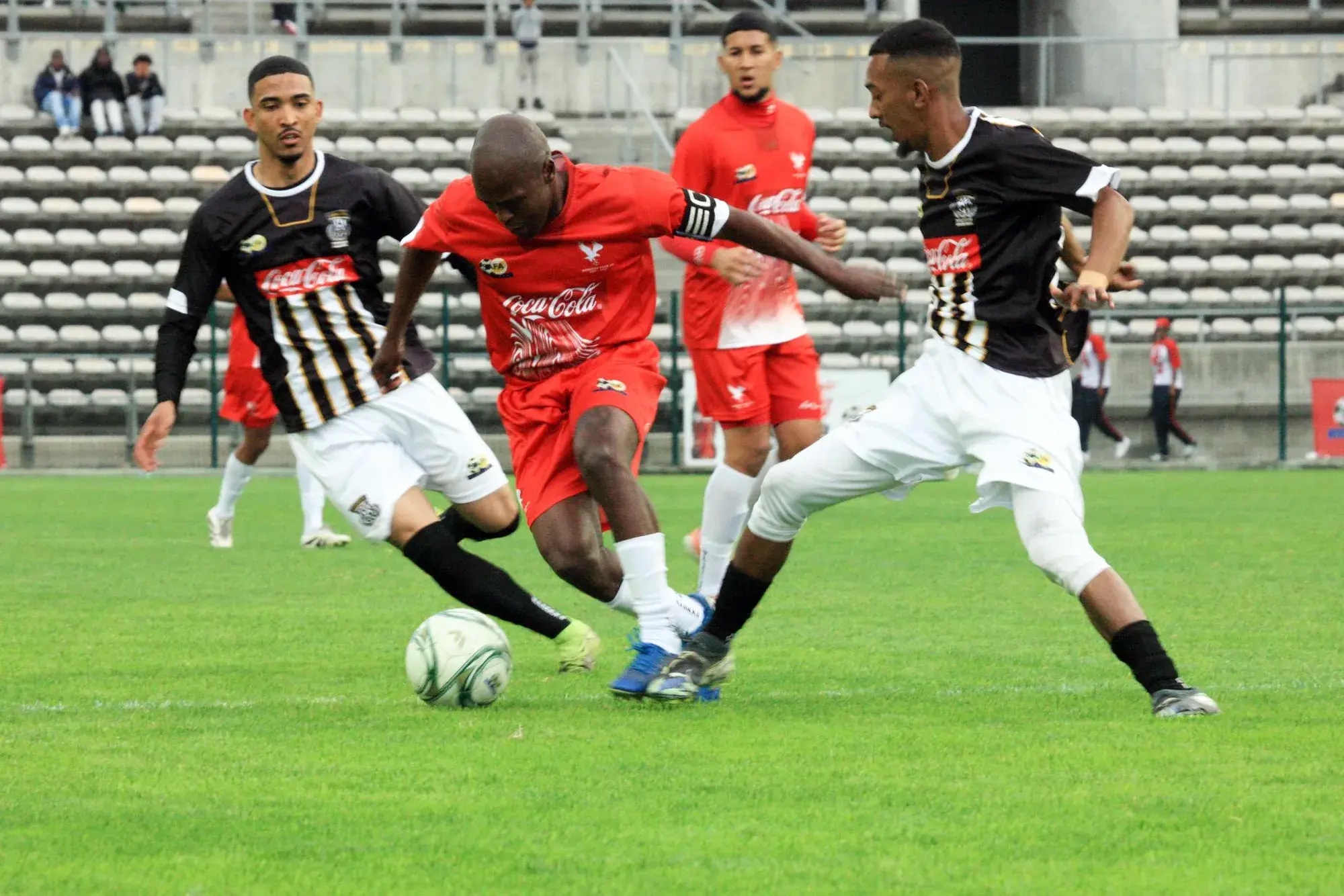 Hanover Park captain Abulele Notywala slips through the defence during his side’s Coke Cup final against Saxon Rovers at Athlone Stadium on Saturday.
