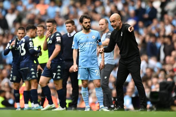 Pep Guardiola gives Bernardo Silva instructions from the touchline