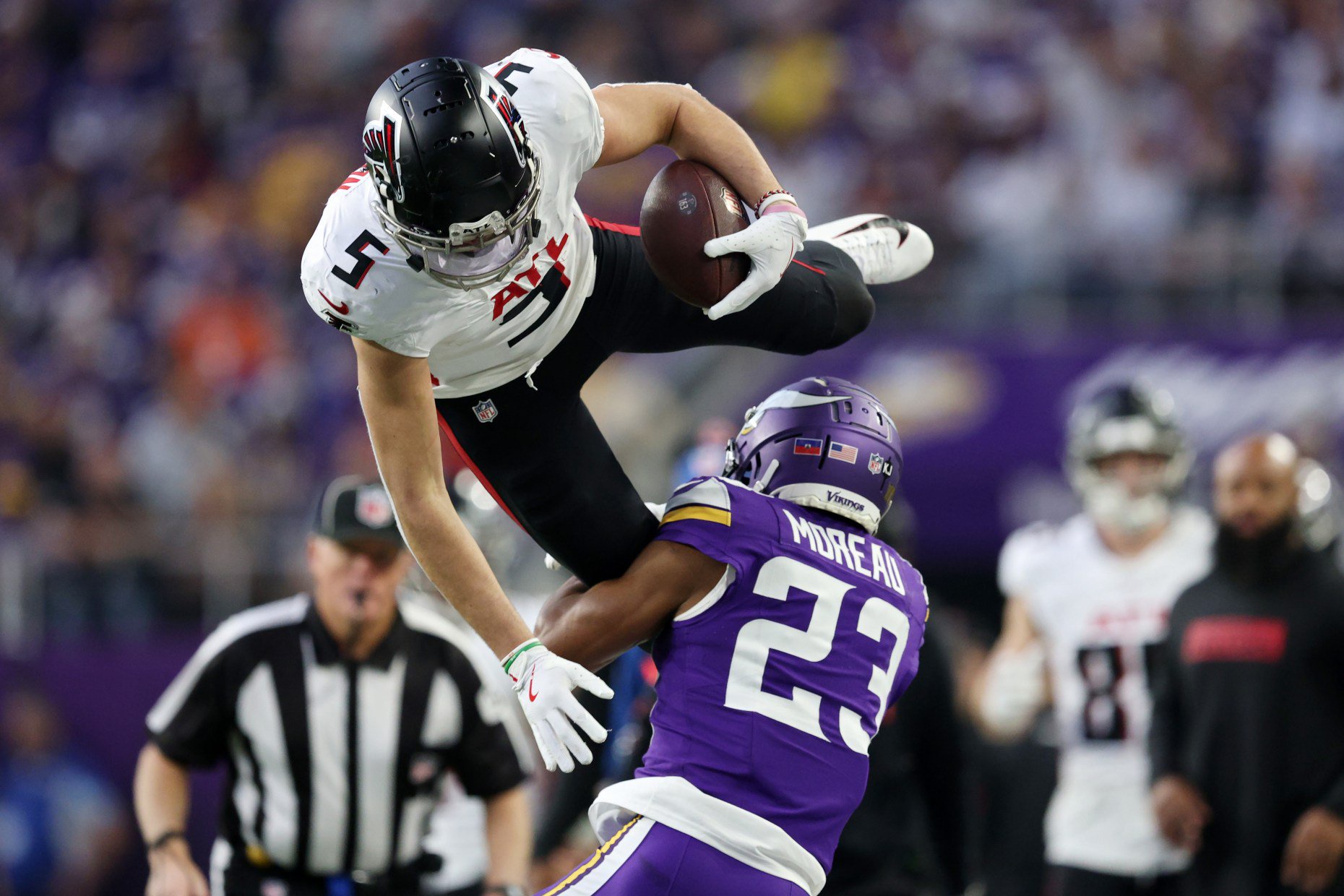 Fabian Moreau #23 of the Minnesota Vikings tackles Drake London #5 of the Atlanta Falcons during the third quarter at U.S. Bank Stadium on Dec. 08, 2024 in Minneapolis, Minnesota. (Photo by David Berding/Getty Images)