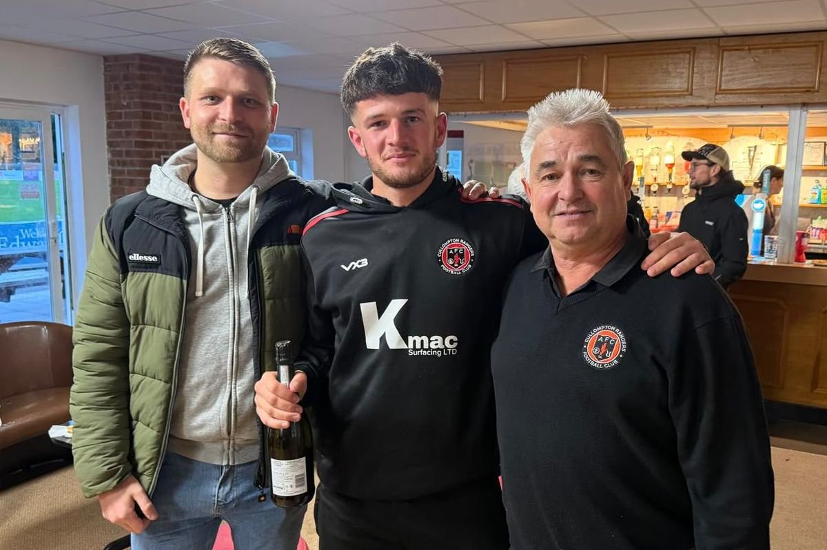 Lloyd White, who scored six goals against Okehampton Argyle, gets his man of the match award
