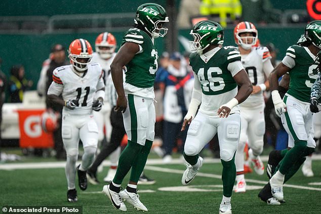 New York Jets linebacker David Bailey (31) celebrates with teammate defensive end Joseph Ossai (46) after a tackle during the first half of an NFL football game against the Cleveland Browns, Sunday, Oct. 11, 2026, in East Rutherford, N.J. (AP Photo/Seth Wenig)