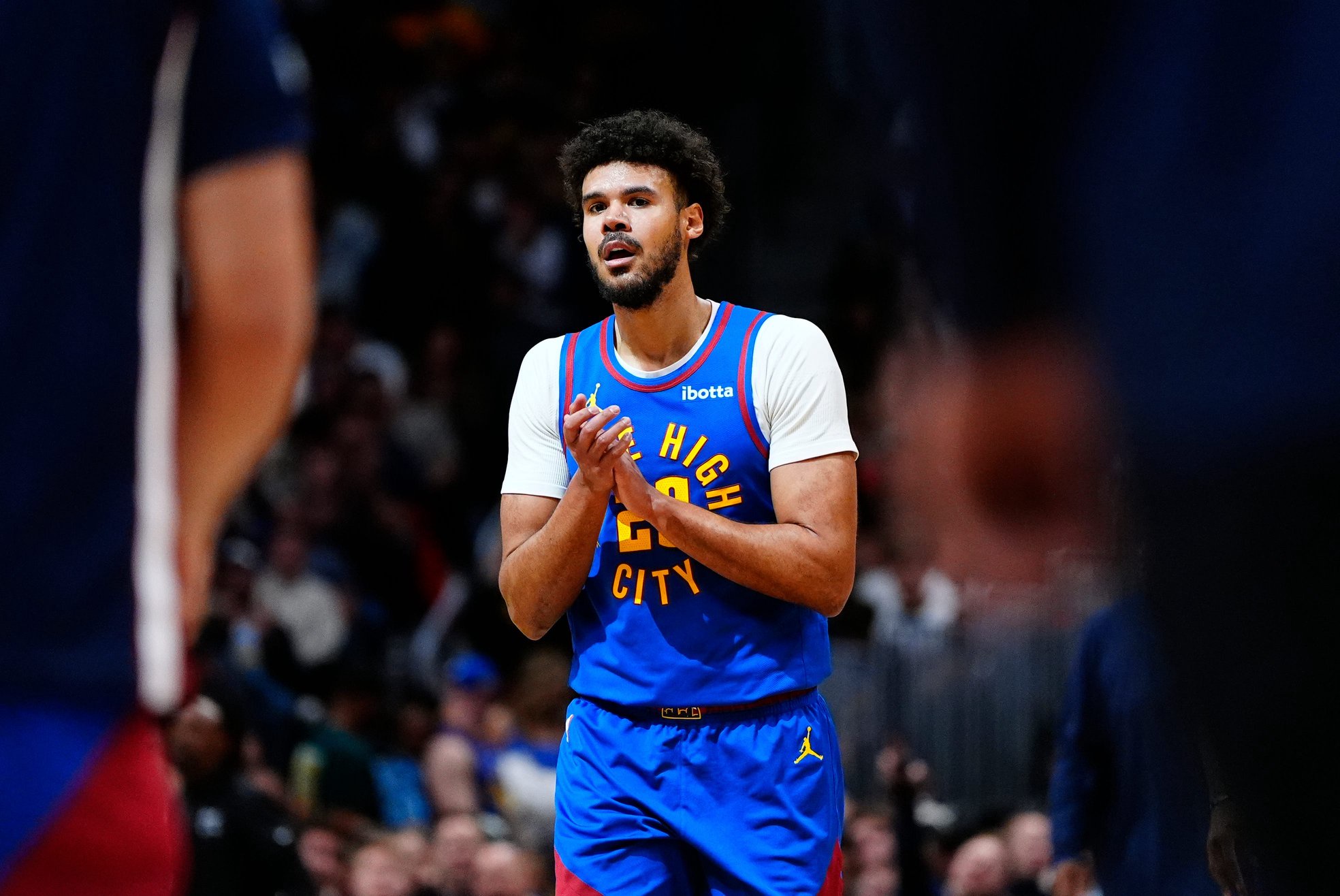 Mar 11, 2026; Denver, Colorado, USA; Denver Nuggets forward Cameron Johnson (23) reacts in the third quarter against the Houston Rockets at Ball Arena. Mandatory Credit: Ron Chenoy-Imagn Images
