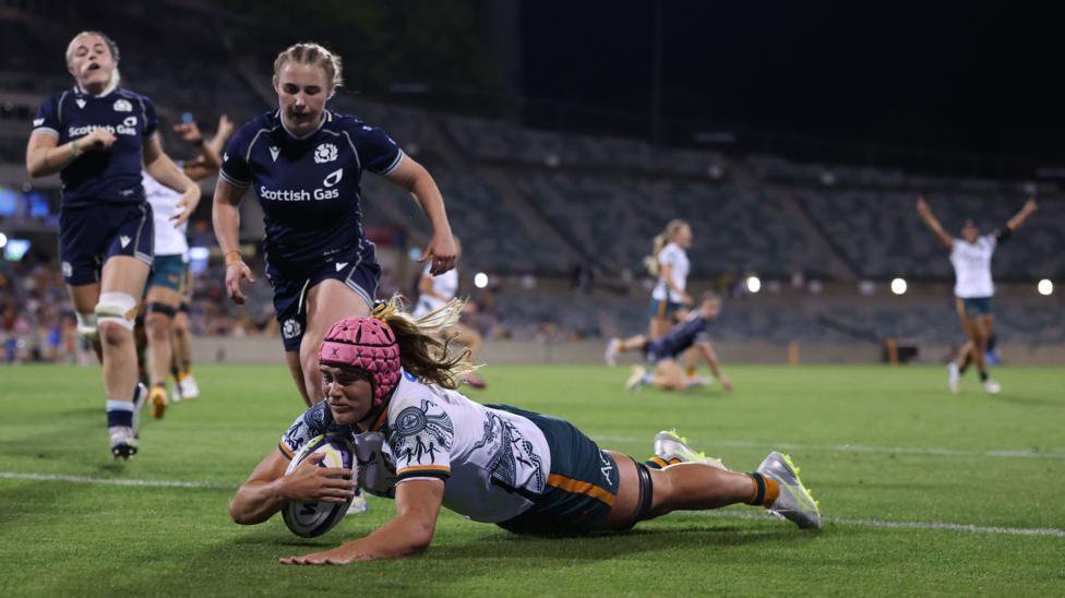 Piper Duck of the Wallaroos dives in to score her team's fourth try during the WXV Global Series test match between Australia Wallaroos and Scotland 