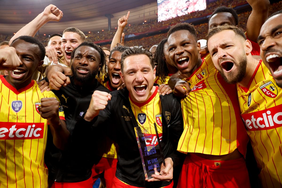 Allan Saint-Maximin (second left) celebrates winning the French Cup with Lens team-mates Saud Abdulhamid, Florian Thauvin, Mamadou Sangare, Jonathan Gradit and Wesley Said