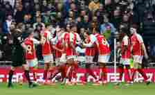 Bukayo Saka of Arsenal celebrates 2nd goal with team mates during the Premier League match between Tottenham Hotspur and Arsenal FC at Tottenham Ho...