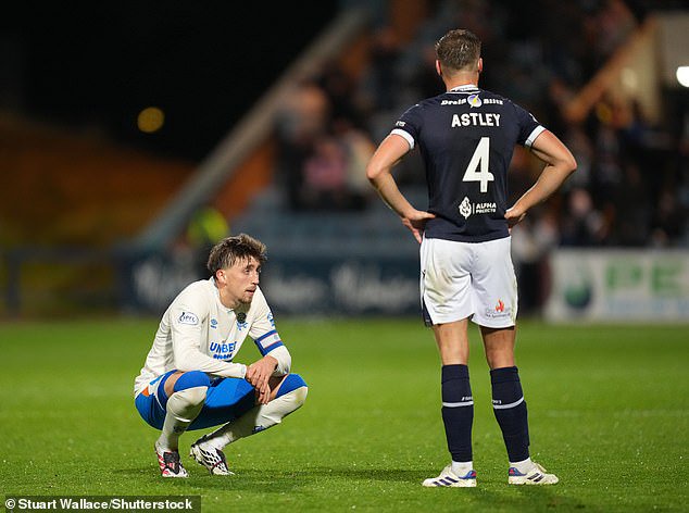 Dan Neil looks crestfallen after the gaffe that proved so costly to the Ibrox side