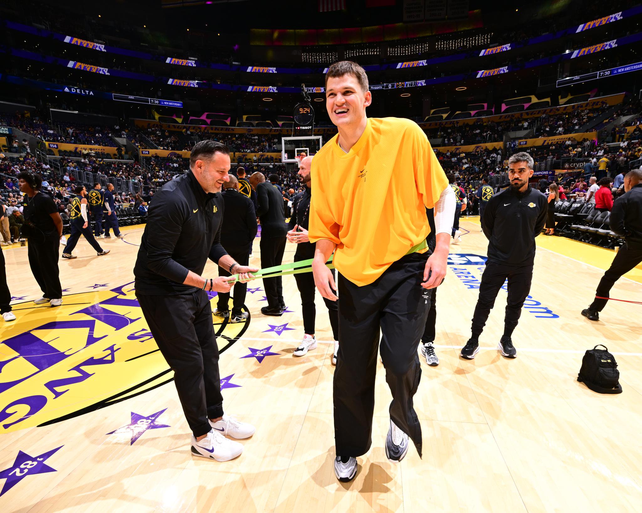Los Angeles Lakers' Walker Kessler (14) warms up before an NBA basketball game against the Denver Nuggets, Friday, Oct. 16, 2026, at Crypto.com Arena in Los Angeles.
