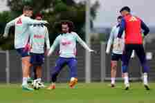 Spain's defender #24 Marc Cucurella (C) along with teammates attend a training session at the team's base camp during the UEFA Euro 2024 Football C...