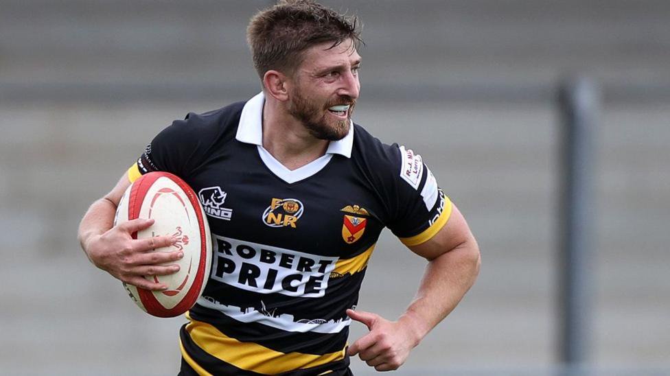 Chay Foster-Smith running in a try for Newport
