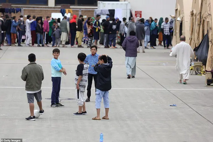 Recreation areas were set up at the Ramstein Air Base  for Afghan evacuees , with children spotted playing on its apron
