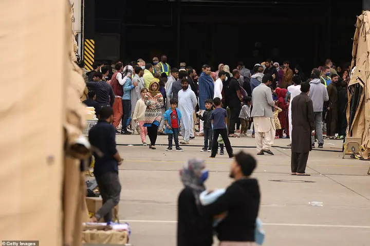 Evacuees from Afghanistan are seen at a temporary emergency shelter at the Ramstein Air Base on August 26