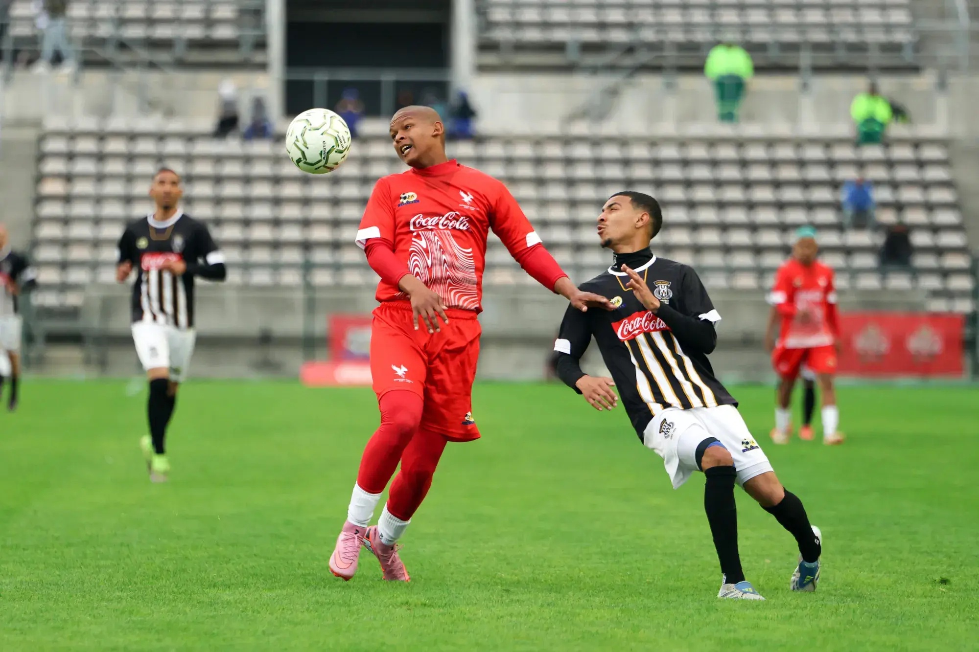 Hanover Park’s Aqeel Jappie heads the ball away from Saxon Rovers’ Zach Moses during their Coke Cup final at Athlone Stadium on Saturday.