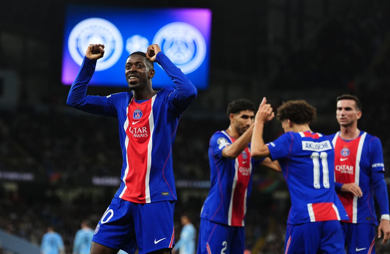 Paris Saint-Germain’s Ousmane Dembele celebrates after team-mate Maghnes Akliouche scores