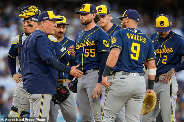Milwaukee Brewers manager Pat Murphy, left, pulls Milwaukee Brewers pitcher Shane Drohan (55) from the game during the second inning of Game 4 of baseball's National League Championship Series between the Milwaukee Brewers and the Los Angeles Dodgers, Thursday, Oct. 15, 2026, in Los Angeles. (AP Photo/Ashley Landis)